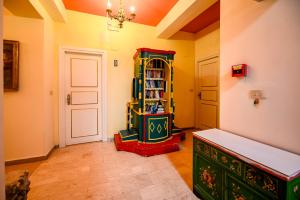 a room with a library with a book shelf and a door at Hotel da Peppe in Letojanni