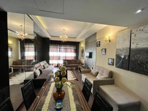 a large living room with couches and a table at The Regency Tanjung Tuan Beach Resort Port Dickson in Port Dickson