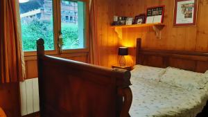 a bedroom with a bed and a window at TellaHouse in Chamonix +12 photos