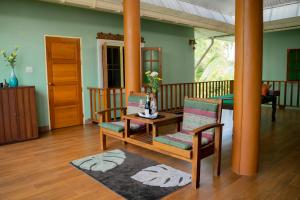 a living room with a table and two chairs at Baan innto resort in Fang