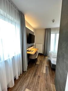 Postel nebo postele na pokoji v ubytování Hotel Seeblick