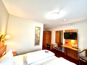 Postel nebo postele na pokoji v ubytování Hotel Seeblick
