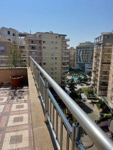 desde un balcón con vistas a la ciudad y a los edificios en Hotel Adria, en Shëngjin