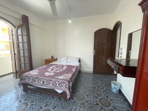 Postel nebo postele na pokoji v ubytování Gîte Hôtel Ramla Louxor
