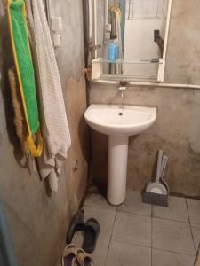 a small bathroom with a sink and a mirror at hostel Mrganush in Meghri