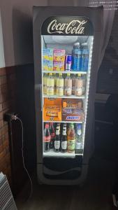 an open refrigerator filled with lots of drinks at Mythos Hotel Oranienburg in Oranienburg