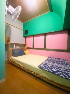 Giường trong phòng chung tại みーまん奄美 +67 ảnh