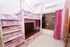 a room with two bunk beds and a window at The Royal Villa in Panchgani +44 photos