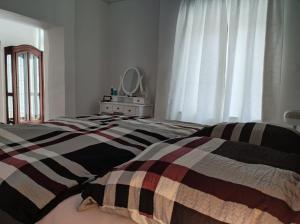Postel nebo postele na pokoji v ubytování Ferienwohnung Gänseblümchen