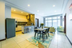 a kitchen and dining room with a table and chairs at 2Bedroom Luxury Apartment, Skynest Residences, Westlands in Nairobi