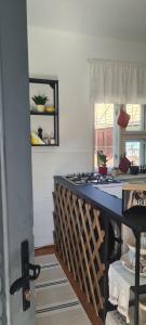 a kitchen with a counter top in a room at Petit Castel in Bran