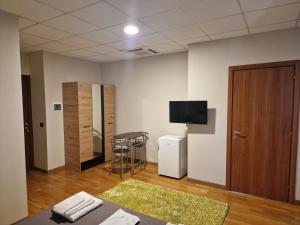 A television and/or entertainment centre at FRANK'S HOUSE