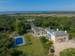 an aerial view of a large house with a pool at Red River Stables - Peaceful, beautiful grounds, swimming pool, central location for West Cornwall in Camborne