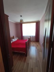 A bed or beds in a room at Kamara Guest House