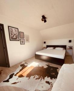 En eller flere senge i et værelse på Romantische vakantiewoning met weids uitzicht
