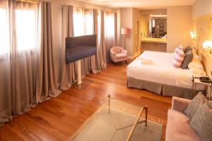 Postel nebo postele na pokoji v ubytování Hotel Don Juan Boutique