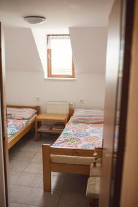 Posteľ alebo postele v izbe v ubytovaní Penzion Nechorka