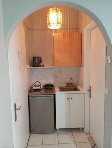 A kitchen or kitchenette at Marilena House Plataria