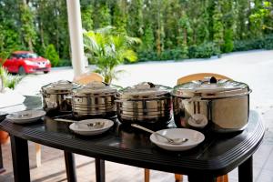 a group of drums sitting on a table at Hazel Retreat - Full Home & Coffee Estate in Chikmagalūr +38 photos