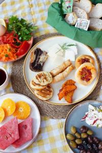 a table with plates of food on a table at Sheriff, Olympos in Kumluca
