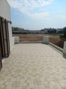 a large patio with a view of a field at Magy's house in Batsi