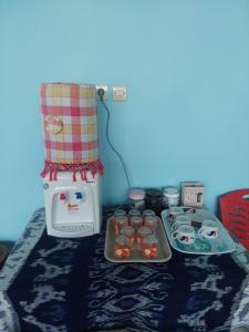 a room with a table with some food on it at D'Ru Guest House in Labuan Bajo +26 photos