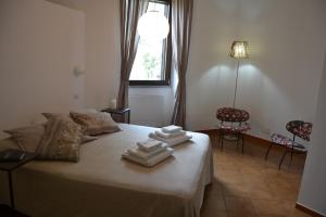 Postel nebo postele na pokoji v ubytování case vacanza Il Castello