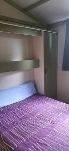 Ένα ή περισσότερα κρεβάτια σε δωμάτιο στο CAMPING RIANXO