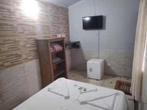 TV a/nebo společenská místnost v ubytování Pousada Lua Clara
