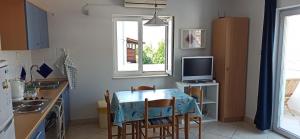 Kuchyňa alebo kuchynka v ubytovaní Apartmani Zulin