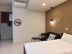 Voodi või voodid majutusasutuse 屏東潮州民宿-綠品文旅Green Inn toas