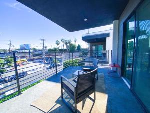 a balcony with a bench and a view of a stadium at Stylish 3 BR/3BR family house in Los Angeles
