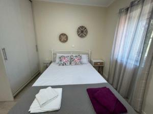 a bedroom with a large bed in a room at Anmare Studios in Nydri