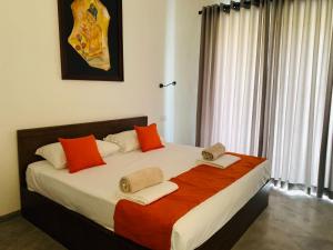 Postel nebo postele na pokoji v ubytování Everdew Kandy Rooms