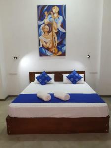Postel nebo postele na pokoji v ubytování Everdew Kandy Rooms