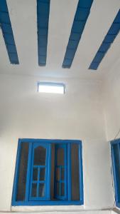 a blue window in a white room with a ceiling at BLUE RIAD in Safi