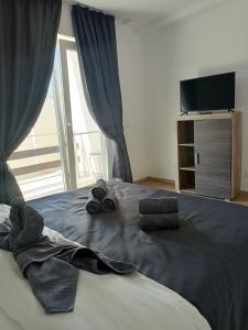 Ένα ή περισσότερα κρεβάτια σε δωμάτιο στο Casa Matei INN Coresi Brasov