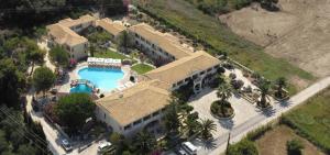 an aerial view of a house with a swimming pool at Karavostasi Beach Hotel in Perdika