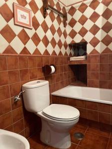 a bathroom with a toilet and a sink and a tub at Molino Los Leones in Ronda +33 photos