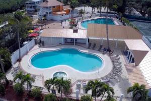 an overhead view of a pool at a resort at BEACHFRONT-Amazing Fishing,Shelling,Sunrise views! in Captiva