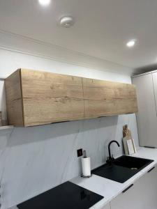 a kitchen with a sink and a counter top at Premium executive Apartment in Dunfermline in Dunfermline