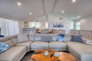 a living room with a couch and a table at BEACHFRONT-Amazing Fishing,Shelling,Sunrise views! in Captiva
