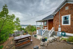 a house with a picnic table in front of it at Klamath Falls Vacation Rental Less Than 1 Mi to Downtown! in Klamath Falls