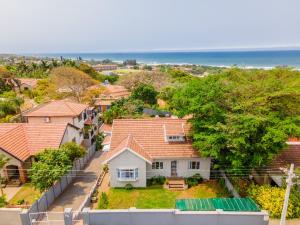 an aerial view of a house with the ocean in the background at Danville Forest Villa in Durban