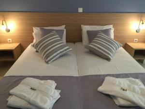 Postel nebo postele na pokoji v ubytování Apollon Hotel