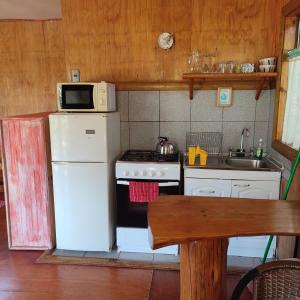 Köök või kööginurk majutusasutuses Cabañas Villa Altué