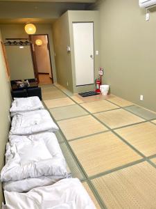 Wafu Ryokan Uehonmachi客房内的一张或多张床位