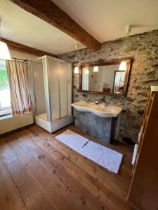 a bathroom with a sink and a mirror at Ferienhaus Holzinger in Rangersdorf