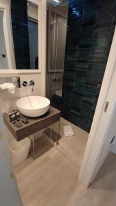 a bathroom with a sink and a shower at Splendid Hotel Taormina in Taormina