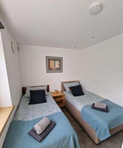 Ένα ή περισσότερα κρεβάτια σε δωμάτιο στο Modern two bedroom house +20 φωτογραφίες